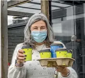  ?? JOHN KIRK-ANDERSON/STUFF ?? Marie Parsons enjoys takeaway coffee for the first time in a fortnight.