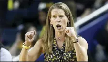  ?? CARLOS OSORIO — THE ASSOCIATED PRESS FILE ?? Michigan head coach Kim Barnes Arico directs her team during the second half of an NCAA college basketball game against Michigan State in Ann Arbor, Mich. The outbreak of the coronaviru­s brought the sports world — the whole world, really — to a screeching halt.