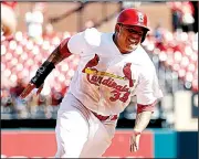  ?? AP/BILLY HURST ?? Yairo Munoz of the St. Louis Cardinals rounds third base to score a run on Patrick Wisdom’s RBI single during the ninth inning of Wednesday’s game.