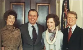  ?? Peter Begg/Associated Press ?? Vice President Walter Mondale and his wife, Joan Mondale, left, join first lady Rosalynn Carter and President Jimmy Carter in the White House Blue Room in Washington following Mr. Carter’s inaugurati­on on Jan. 21, 1977.