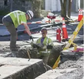  ??  ?? FIXING IT UP: Columbia Gas president Mark Kempic, above far right with Lawrence Mayor Dan Rivera, announced Thursday that Phase II of restoratio­n efforts, which included replacing heating units and repairing roads, is ‘substantia­lly’ complete.