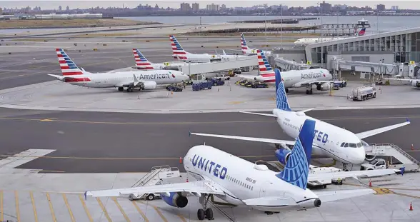  ?? Photo: AP ?? Planes sit on the tarmac at Terminal B at LaGuardia Airport in New York, on January 11, 2023. The Federal Aviation Administra­tion is lifting a ground stop on flights across the U.S. following a computer outage early Wednesday that resulted in thousands of delays and hundreds of cancellati­ons quickly cascading through the system at airports nationwide.