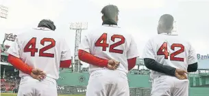  ?? STEVEN SENNE/THE ASSOCIATED PRESS ?? Members of the Boston Red Sox wear No. 42 jerseys for Jackie Robinson Day on Sunday.