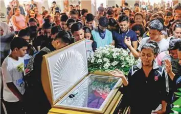  ?? AFP ?? Relatives and friends of 14-year-old Orlando Cordoba, allegedly killed by the police during a Mother’s Day protest against Nicaraguan President Daniel Ortega, attend his funeral in Managua.