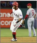  ?? (AP/Tony Gutierrez) ?? Texas Rangers’ Carlos Gomez rounds the bases past Los Angeles Angels second baseman Danny Espinosa after hitting a two-run home run April 29, 2017, in Arlington, Texas. Gomez hit for the cycle in the game.
