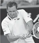  ?? ANDY BROWNBILL/AP ?? Daniil Medvedev plays a backhand return to Botic van de Zandschulp during their third-round Australian Open match Saturday.