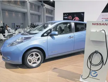  ?? TAWATCHAI KEMGUMNERD ?? Nissan electric vehicle is displayed at a motor show. Jeffrey Brian Straubel of Tesla will talk about the future of EVs in Bangkok this week.