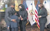  ?? MANUEL BALCE CENETA — THE ASSOCIATED PRESS ?? Vice President Kamala Harris, right, watches EPA administra­tor Michael Regan gives his wife Melvina Thomas Regan and son Matthew Silas, 7, a hug during a ceremonial swearing-in ceremony in the Vice President’s Ceremonial Office at the Eisenhower Executive Office Building on the White House complex in Washington, on March 17.