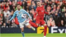  ?? Michael Regan/Getty Images ?? Liverpool’s Darwin Nunez controls the ball while under pressure from Bernardo Silva of Manchester City on Sunday.