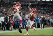  ?? LYNNE SLADKY — THE ASSOCIATED PRESS ?? The Chiefs’ Travis Kelce (87) celebrates his touchdown with Damien Williams during the second half of the Super Bowl on Feb. 2.