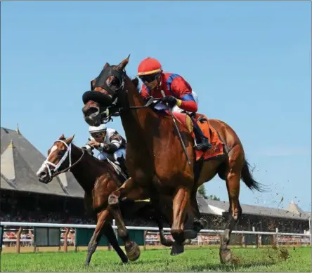  ?? PHOTO CHELSEA DURAND/NYRA ?? Sandy’z Slew with Jose Ortiz races towards the wire inside of Blind Ambition and Javier Castellano to win Sunday’s Grade 3 Troy.