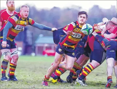  ??  ?? Left, Ashford’s Jack Weaver gets the ball out, with Dan Brown in support during Saturday’s defeat to Lewes. Right, Ashford’s Ben King held up, with Matt Richards in support