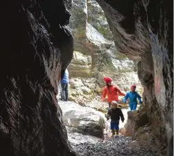  ??  ?? ABOVE The Benson family explores Chapel Porth’s natural arches and caves at low tide – the whole beach disappears at high tide