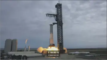  ?? SPACEX VIA AP ?? A Starship first-stage Super Heavy booster performs an engine-firing test at the launch pad in Boca Chica, Texas, on Thursday.