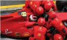  ?? Photograph: Emilio Morenatti/Reuters ?? Ferrari mechanics struggle with Charles Leclerc’s car before he is forced to retire from the race.