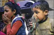  ??  ?? In an image released Sunday by the Syrian Civil Defense White Helmets group,a child receives oxygen through respirator­s after an alleged poison gas attack in the rebel-held town of Douma, near Damascus, Syria.