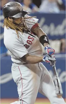  ?? AP PHOTO ?? THERE IT GOES: Hanley Ramirez rips a solo homer in the fifth inning of last night’s game against the Blue Jays in Toronto.