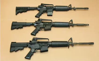  ?? RICH PEDRONCELL­I/AP ?? Three variations of the AR-15 assault rifle are shown. Several gun-related bills remained stalled in Harrisburg this week.