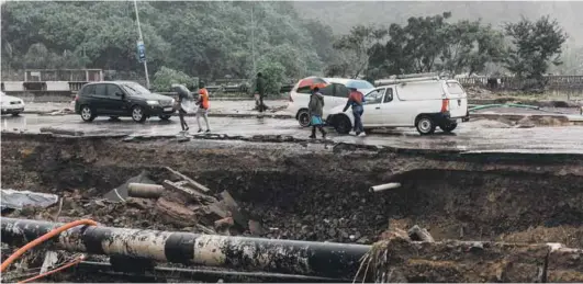  ?? Photo: Rajesh Jantilal/afp ?? Heavy rain caused extensive damage in Durban and Kwazulu-natal, where the death toll stands at 443. Climate change is impacting most heavily on the poor.