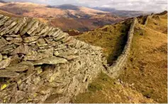  ??  ?? A long drystone wall follows the undulation­s of Lingmoor Fell, at Langdale in the Lake District. They can last for hundreds of years.
