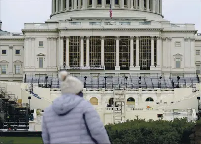  ?? PATRICK SEMANSKY — THE ASSOCIATED PRESS ?? Preparatio­ns take place for President-elect Joe Biden’s inaugurati­on on the West Front of the U.S. Capitol in Washington on Friday.