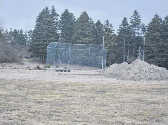  ?? NICHOLAS MERCER • SALTWIRE NETWORK ?? The backstop is all that is left of the old ball field in Bay Roberts at the town’s community gardens. The town is converting that land into a new sensory garden and outdoor space.