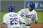  ?? CHARLIE RIEDEL — THE ASSOCIATED PRESS ?? In a Sept. 24, 2020, photo, Kansas City Royals’ Salvador Pérez celebrates with third base coach
Vance Wilson after hitting a three-run homer against the Detroit Tigers in Kansas City, Mo.