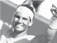  ?? Associated Press ?? ■ Spain’s Rafael Nadal celebrates winning the men’s singles final match of the Monte Carlo Tennis Masters tournament Sunday against Japan’s Kei Nishikori in two sets, 6-3, 6-2, in Monaco.