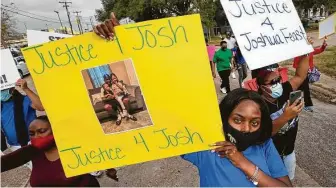  ?? Stuart Villanueva / Galveston County Daily News ?? Jaylon Cummins and other protesters march to La Marque City Hall in response to the shooting death of 22-year-old Joshua Feast.