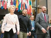  ?? VIRGINIA MAYO/AP ?? European Commission President Ursula von der Leyen, from left, Ukraine President Volodymyr Zelenskyy and European Council President Charles Michel walk together Feb. 9 during a European Union summit in Brussels.