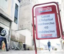  ?? PHOTO: REUTERS ?? Local news . . . A billboard for the newspaper in Laval reads ‘‘Laval hospital is looking for 40 doctors’’.