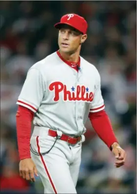  ?? TODD KIRKLAND — THE ASSOCIATED PRESS ?? Phillies manager Gabe Kapler walks the well-trodden path back to the dugout after an extended pitching change in the third inning Saturday night, one of many switches that ended with utilityman Pedro Florimon on the mound and the Phillies on the wrong...