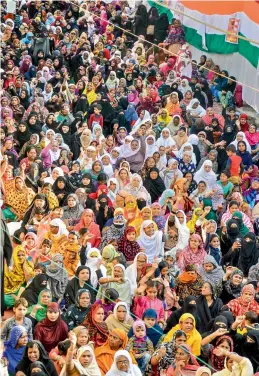  ?? — PTI ?? Muslim women hold placards during the fourth day of their protest against the CAA and the NRC at Raddi Chowki in Jabalpur on Thursday.