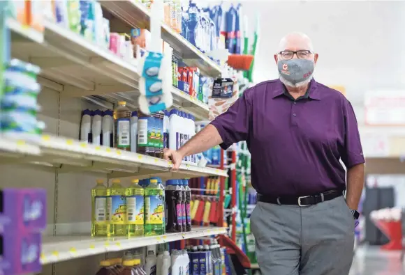  ?? GERSH / THE COMMERCIAL APPEAL MAX ?? Rick James, owner and CEO of Cash Saver, says some cleaning supplies are still hard to keep in stock. Photograph­ed Monday, Sept. 14 at Cash Saver in Memphis.