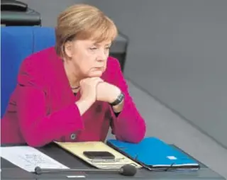  ?? AFP ?? Angela Merkel, ayer, en el Parlamento alemán