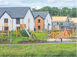  ?? Picture: Steve MacDougall ?? Homes under constructi­on at Springfiel­d’s Bertha Park developmen­t in Perth.