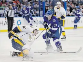  ?? ASSOCIATED PRESS FILES ?? Ste-Agathe native Jonathan Drouin, a Tampa Bay Lightning prospect, centre, is getting ready to join Team Canada for the world junior championsh­ips in Malmo, Sweden.