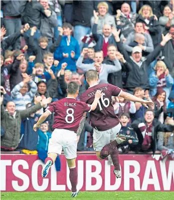  ??  ?? Ryan Stevenson celebrates scoring against Celtic with Ian Black in 2011