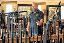  ?? Hyoung Chang, The Denver Post ?? “If I have to put 1,100 guns in a safe every night, I don’t have a physical way to do it,” said Giovanni Galeano, owner of Old Steel Historical Firearms.