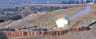  ??  ?? Turkish artillery fire toward Syrian Kurdish positions Friday from the Turkish side of the border, in Hatay, southern Turkey. Turkey’s President Recep Tayyip Erdogan repeated Saturday that a Turkish offensive against the Syrian Kurdish-controlled...