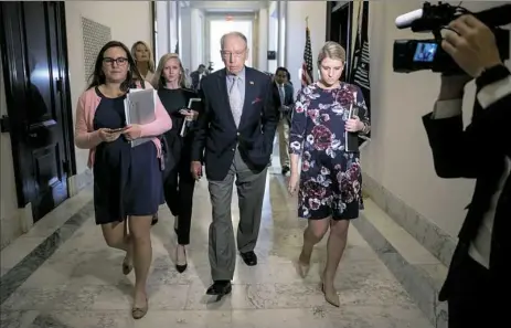  ?? Andrew Harnik/Associated Press ?? Senate Judiciary Committee Chairman Chuck Grassley, R-Iowa, departs after speaking to reporters Wednesday on Capitol Hill. Christine Blasey Ford wants the FBI to investigat­e her allegation that she was sexually assaulted by Supreme Court nominee Brett Kavanaugh before she testifies at a Senate Judiciary Committee hearing next week.