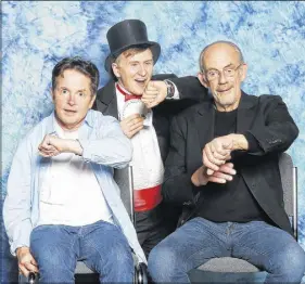  ?? SUBMITTED PHOTO ?? David Johnston joined Michael J. Fox and Christophe­r Lloyd in the Back to the Future “looking at their watches” pose. Johnston met the actors at an event in Toronto in September.