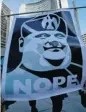  ?? TYLER ANDERSON/POSTMEDIA NEWS ?? Protesters hold a sign at a protest Wednesday against Toronto Mayor Rob Ford in front of Toronto city hall.