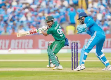  ?? Associated Press ?? ↑
Bangladesh’s captain Najmul Hossain Shanto plays a shot during their World Cup match against India on Thursday.