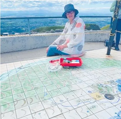  ?? Photo / Supplied ?? Ceramic artist Judith Rosamund returned to Hawke’s Bay to help with the maintenanc­e of her Te Mata Peak map mural.