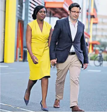  ?? ?? A poll of Conservati­ve Party members ranked Kemi Badenoch, seen with husband Hamish, as favourite after the first TV debate