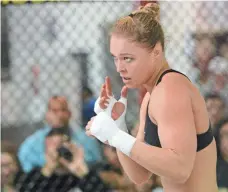  ?? 2013 PHOTO BY JAYNE KAMIN-ONCEA, USA TODAY SPORTS ?? Ronda Rousey, who made her MMA debut in March 2011, will return to the octagon Dec. 30 in UFC 207 in Las Vegas.