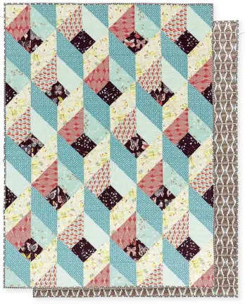  ??  ?? This simple-to-piece quilt top is perfect for showcasing a collection of prints.