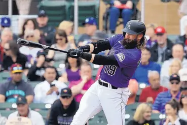  ?? ROSS D. FRANKLIN/ASSOCIATED PRESS ?? Colorado’s Charlie Blackmon and his teammates are to re-open preseason training next week. On Tuesday, though, it was reported three Rockies players tested positive for the coronaviru­s after a workout in Denver.