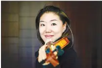 ?? (Courtesy Photo) ?? Profession­al violinist and UA professor of music Er-Gene Kahng recently returned to Fayettevil­le from London following expanded travel bans in response to the global spread of covid-19. Kahng discusses her travel and her experience as a musician in a time when concerts and other large gatherings are canceled for the foreseeabl­e future.